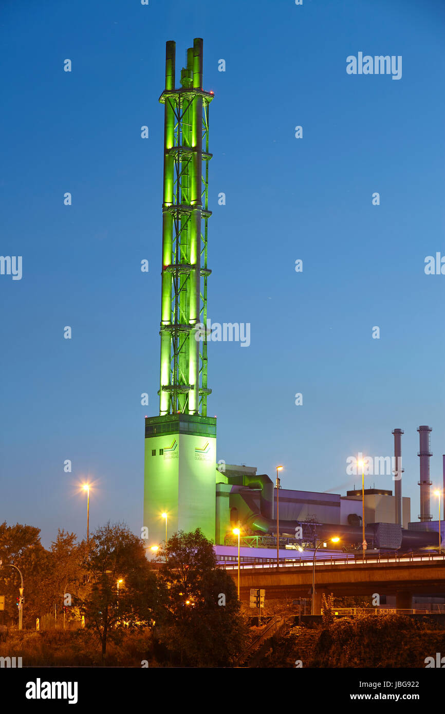 The picture was taken in the evening and shows the tower of the municipals utilities (incinerator). Stock Photo