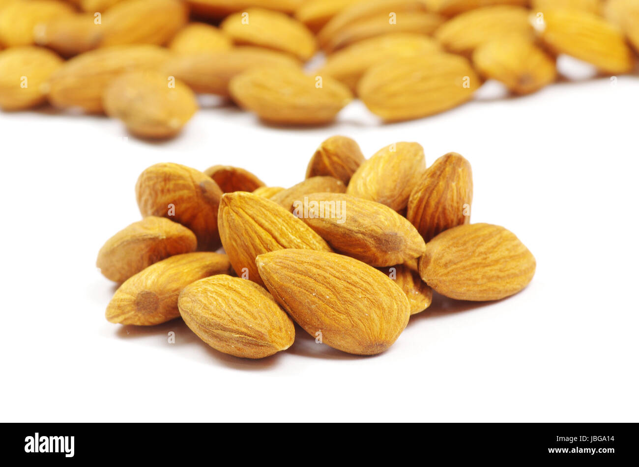 almonds isolated on a white Stock Photo - Alamy