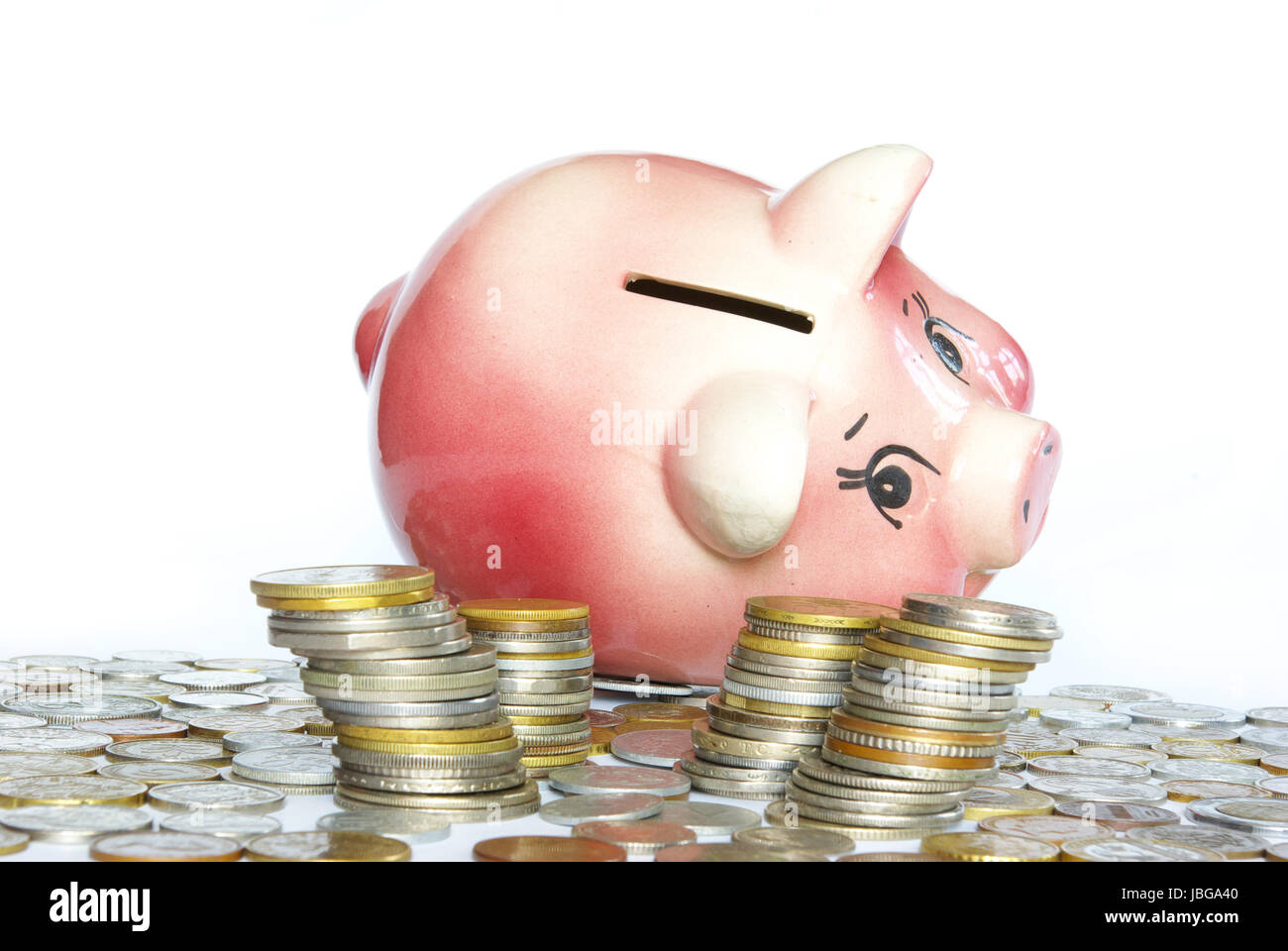 Pink piggy bank isolated on white background with coins Stock Photo - Alamy