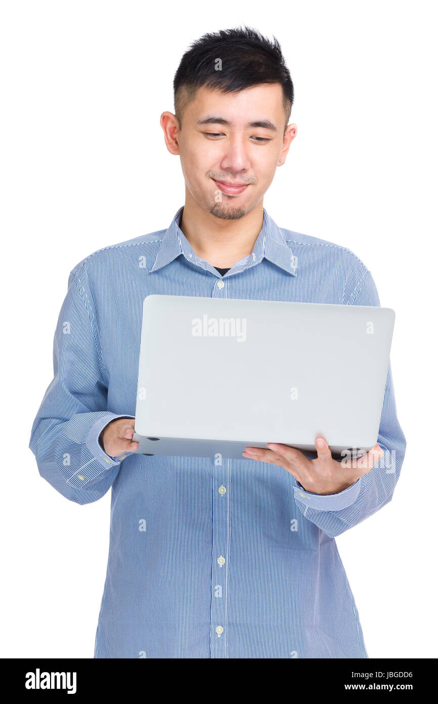 Asian man using laptop computer Stock Photo - Alamy