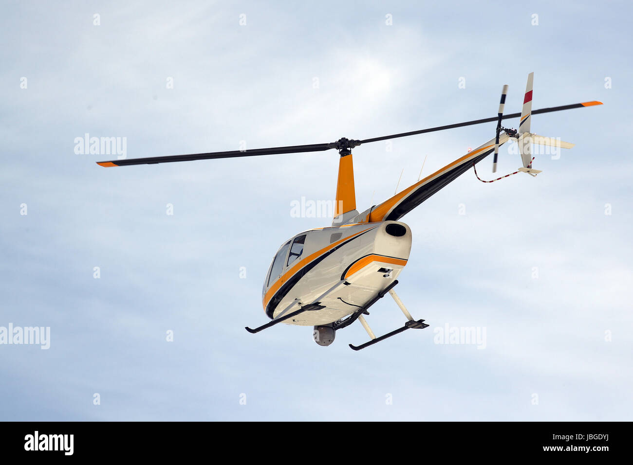Small turbine helicopter in flight with camera and FLIR equipment Stock Photo