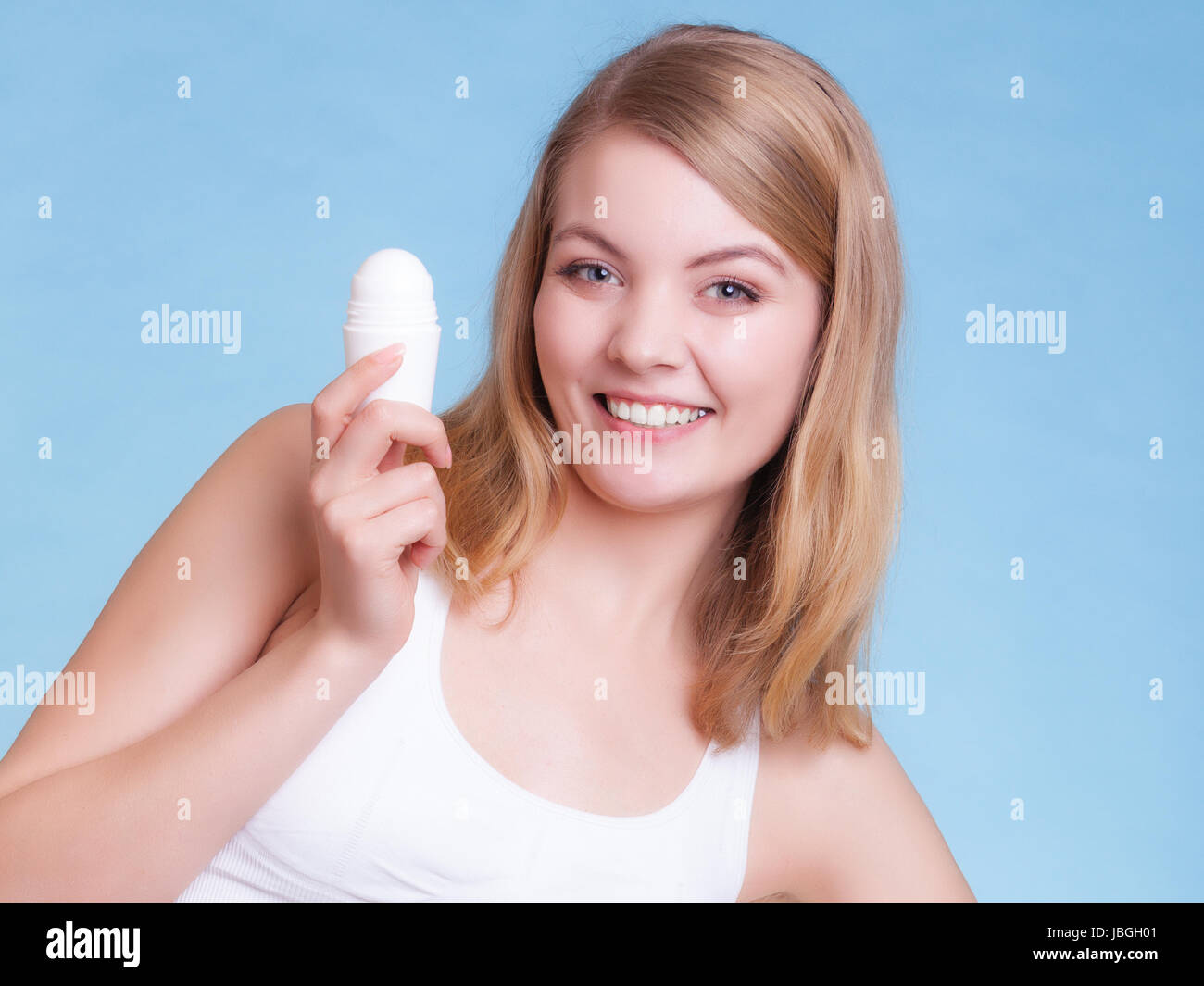 Woman applying deodorant in stick hires stock photography and images