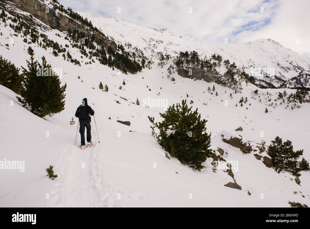 Skiing, winter, skiers on ski run, mountain Pyrenees Stock Photo