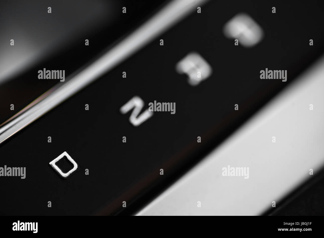 Closeup shot of the positions of an automatic gear shifter in a car