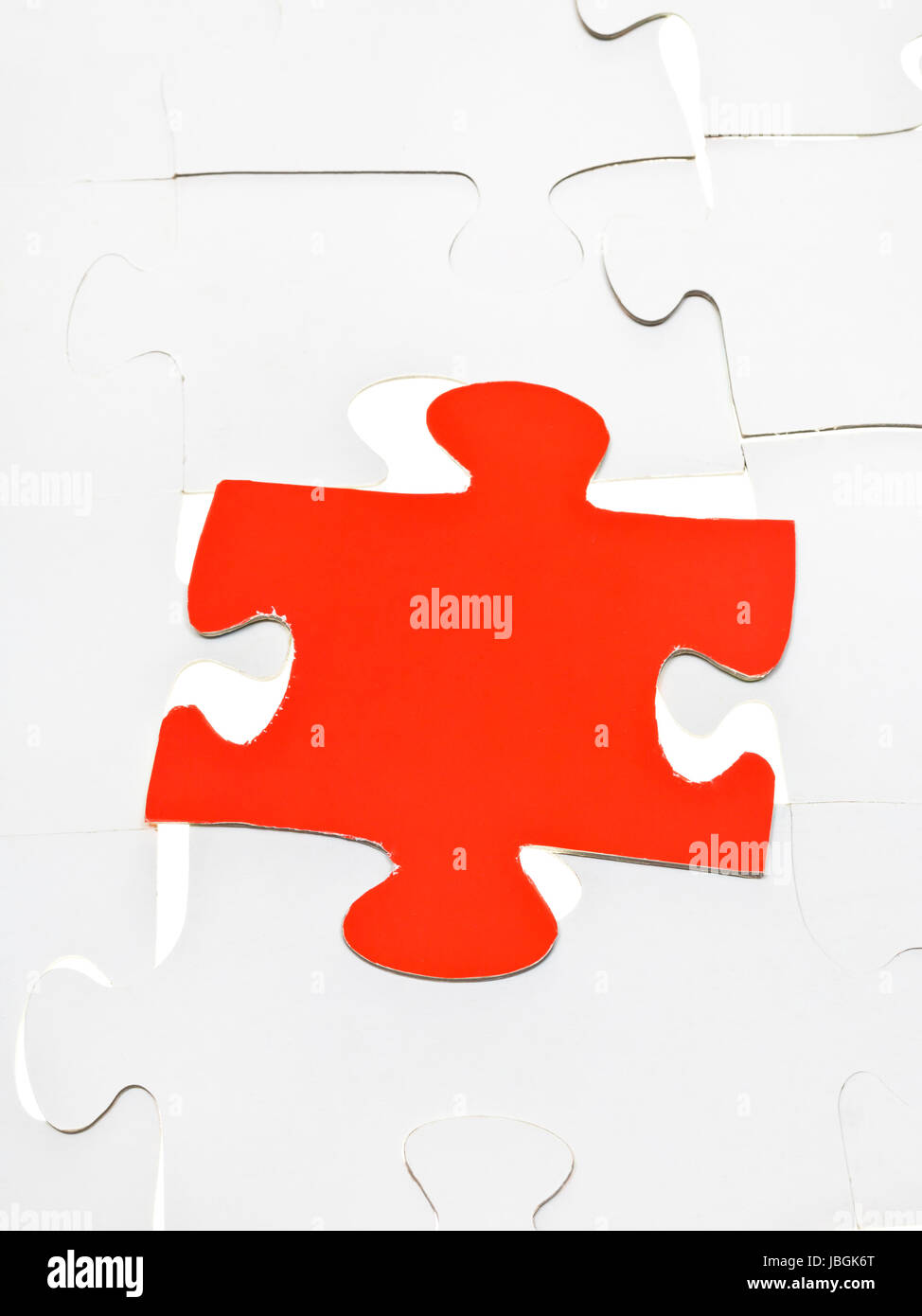 red puzzle piece on layer assembled puzzles Stock Photo Alamy
