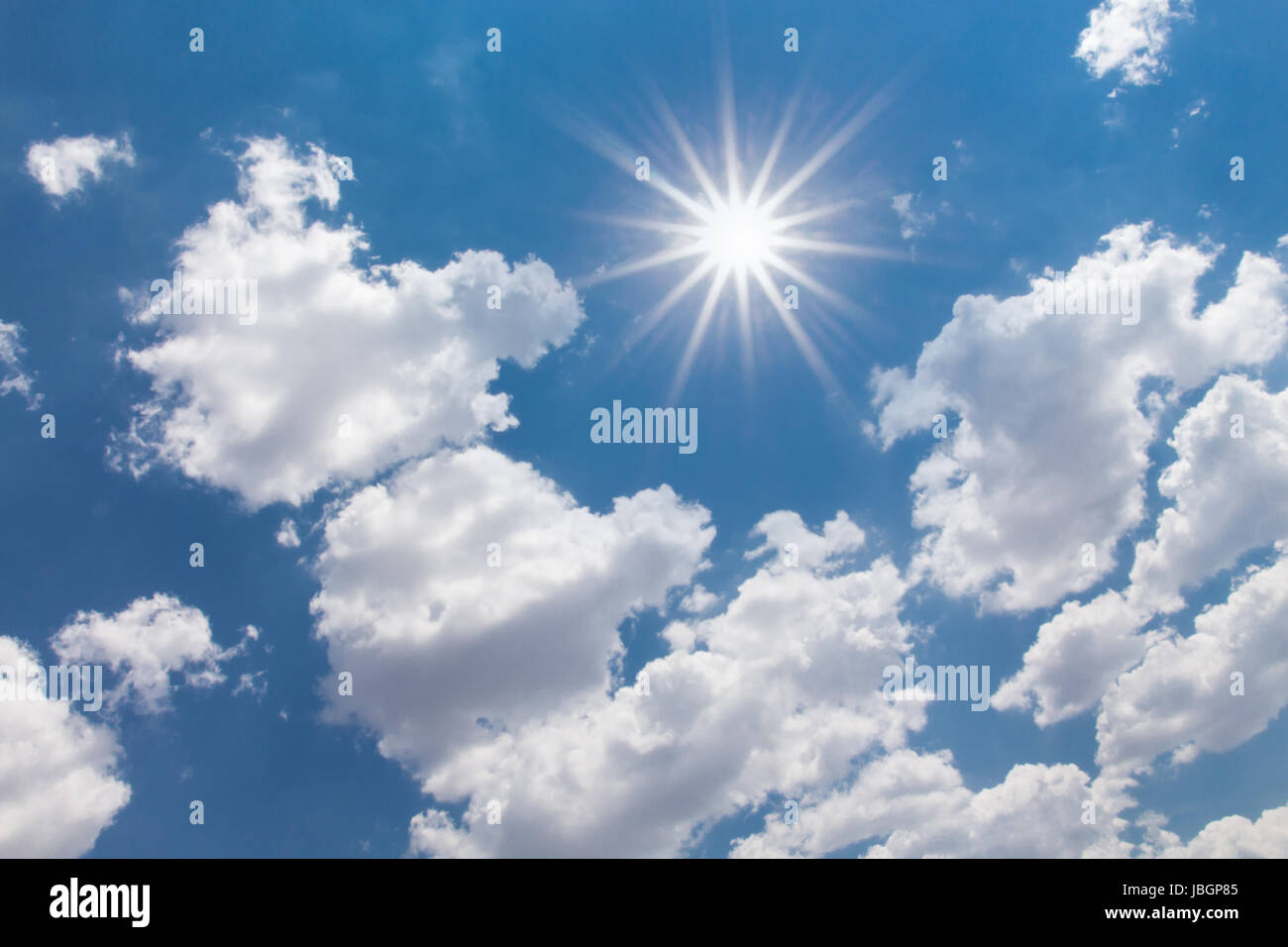 Image of Sun Shining Between Clouds Stock Photo - Alamy