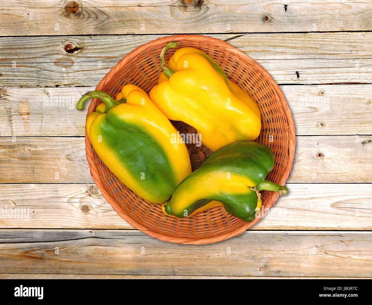 Peppers on wooden background Stock Photo - Alamy