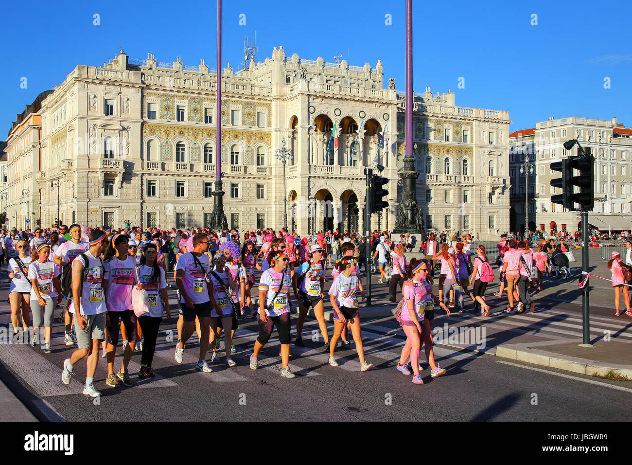 People taking part in The Color Run in Trieste, Italy. Trieste is the capital of the autonomous region Friuli-Venezia Giulia Stock Photo