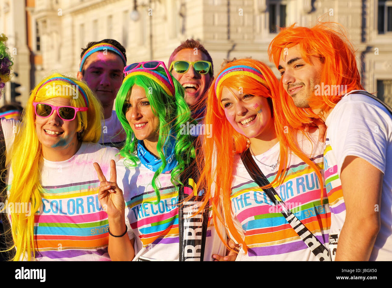 People posing for photos during The Color Run in Trieste, Italy. Trieste is the capital of the autonomous region Friuli-Venezia Giulia Stock Photo