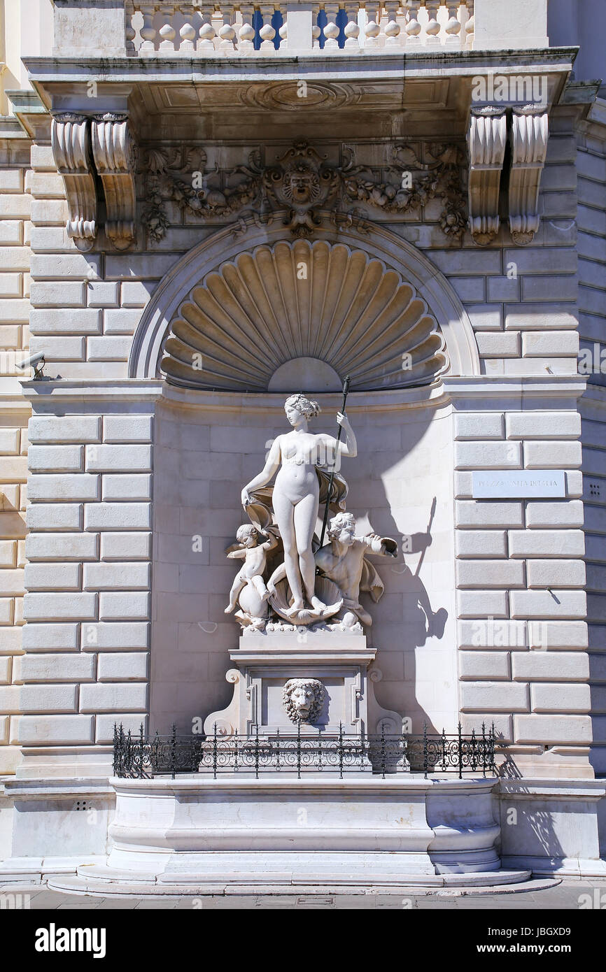 Statues on the facade of Palazzo del Lloyd Triestino on Piazza Unita d'Italia, Trieste, Italy. Trieste is the capital of the autonomous region Friuli- Stock Photo