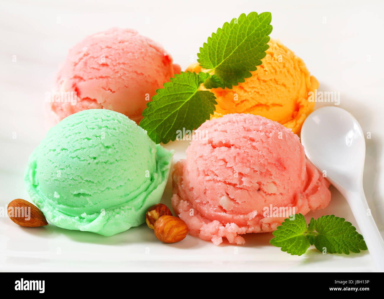 Scoops of ice cream on plate Stock Photo Alamy