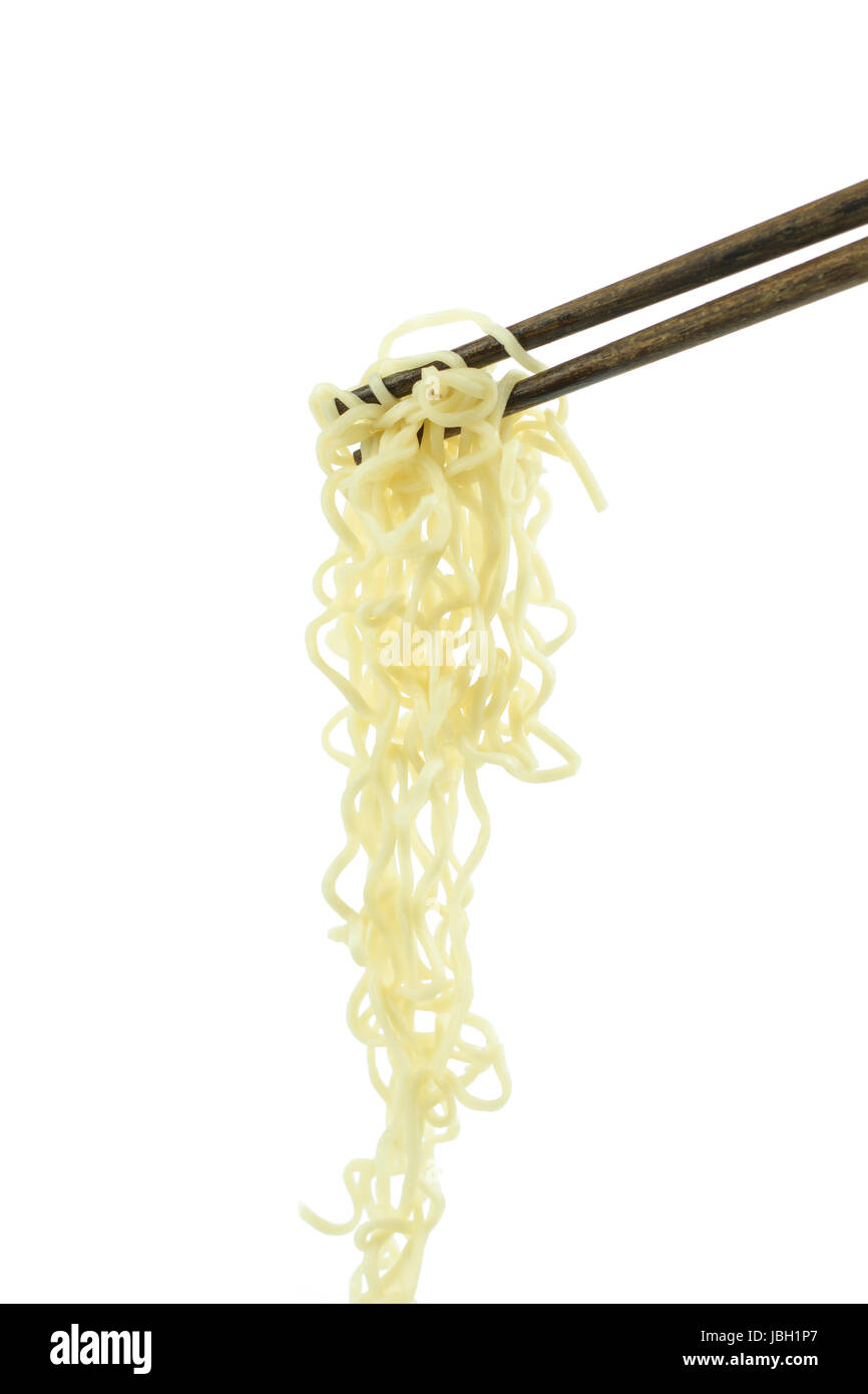 chopsticks holding oriental noodles isolated on a white background Stock Photo