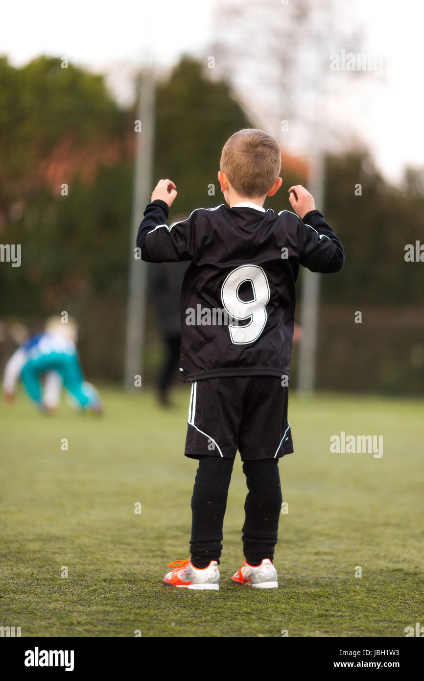 Young caucasian soccer player wearing a soccer jersey with number nine