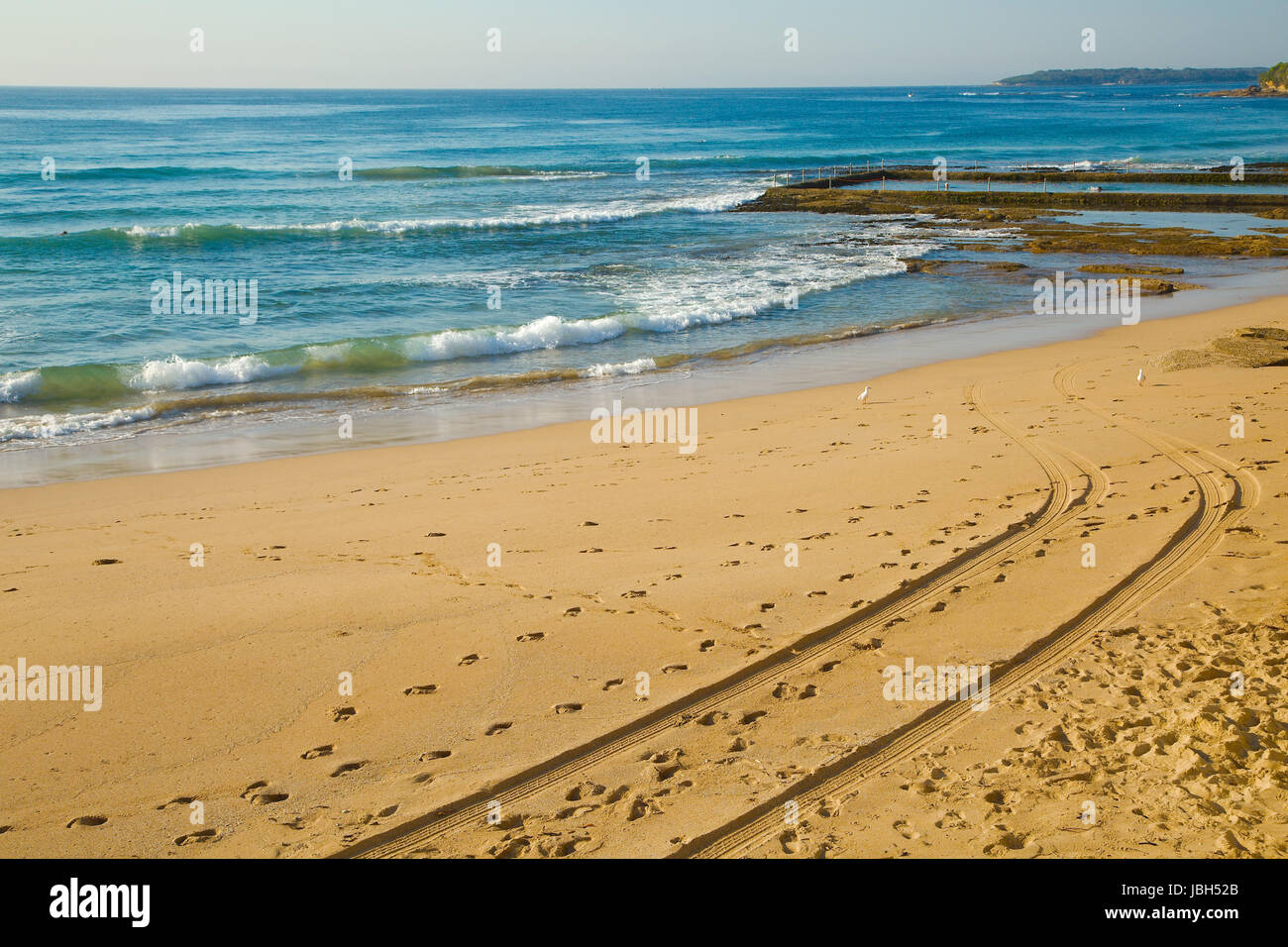Sandy beach with blue sky Stock Photo - Alamy