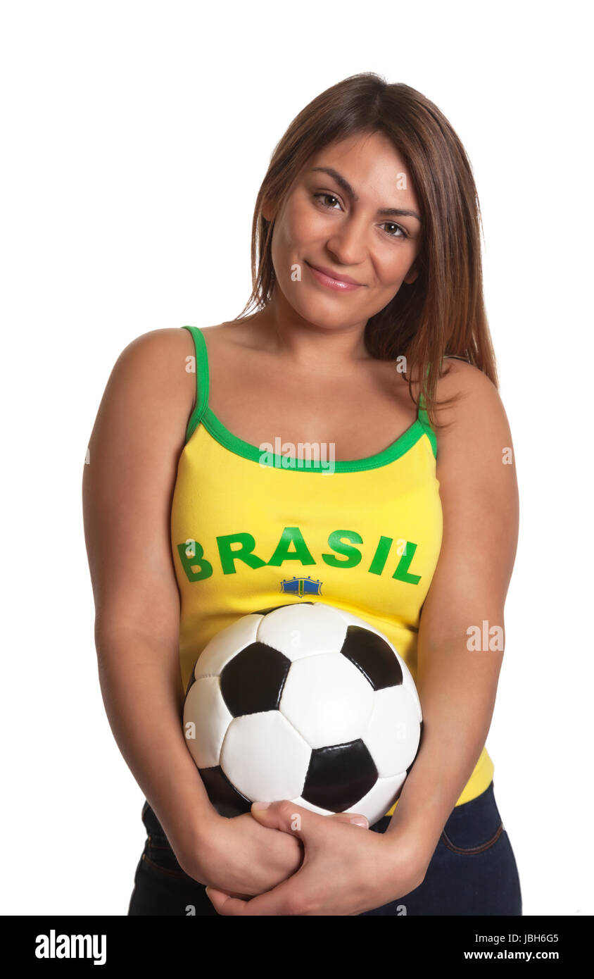 Beautiful brazilian girl with football in her hands waiting for the world cup kick off and smiling at camera on an isolated white background Stock Photo