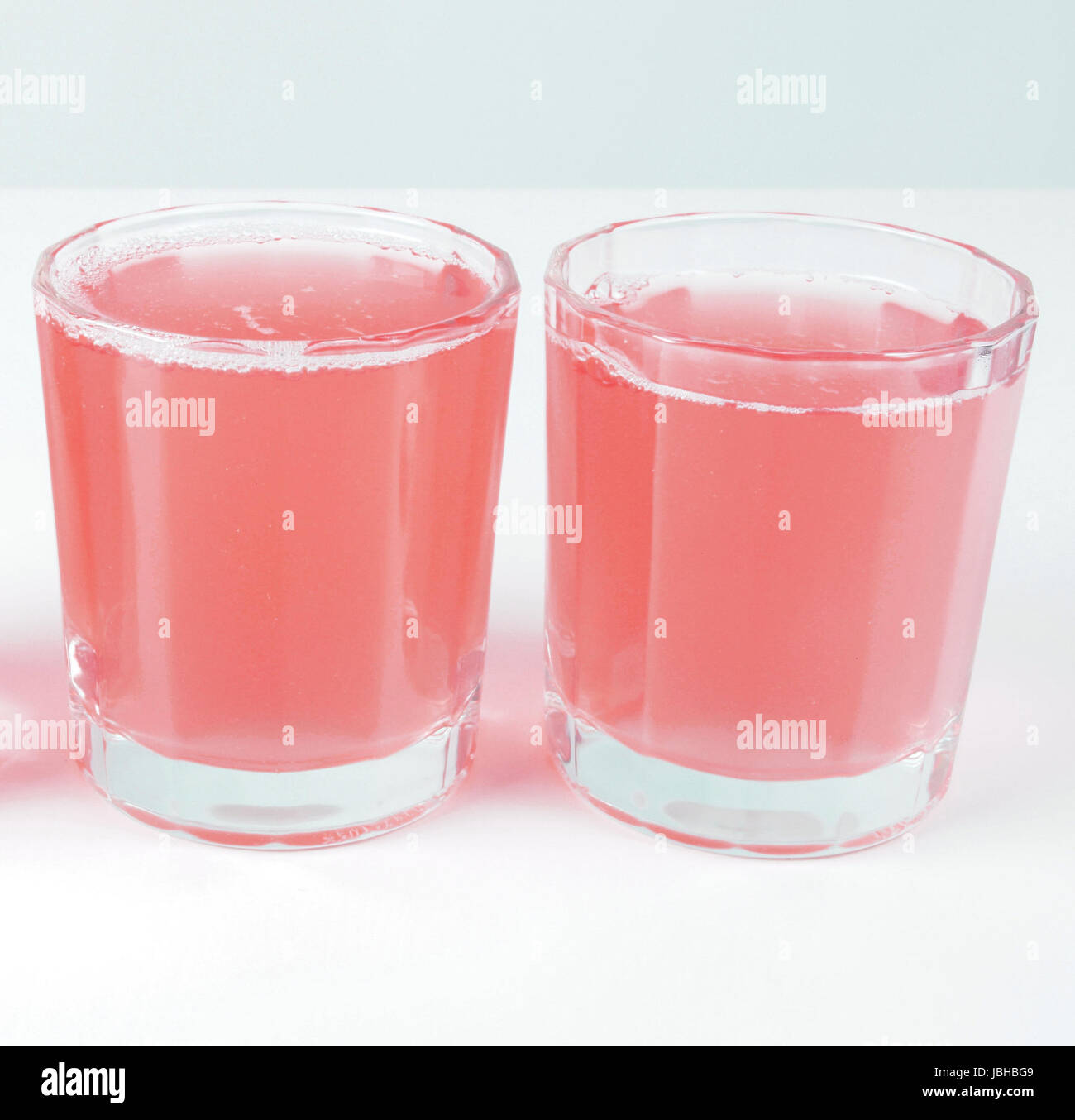 Pink grapefruit juice glasses on continental breakfast table Stock ...