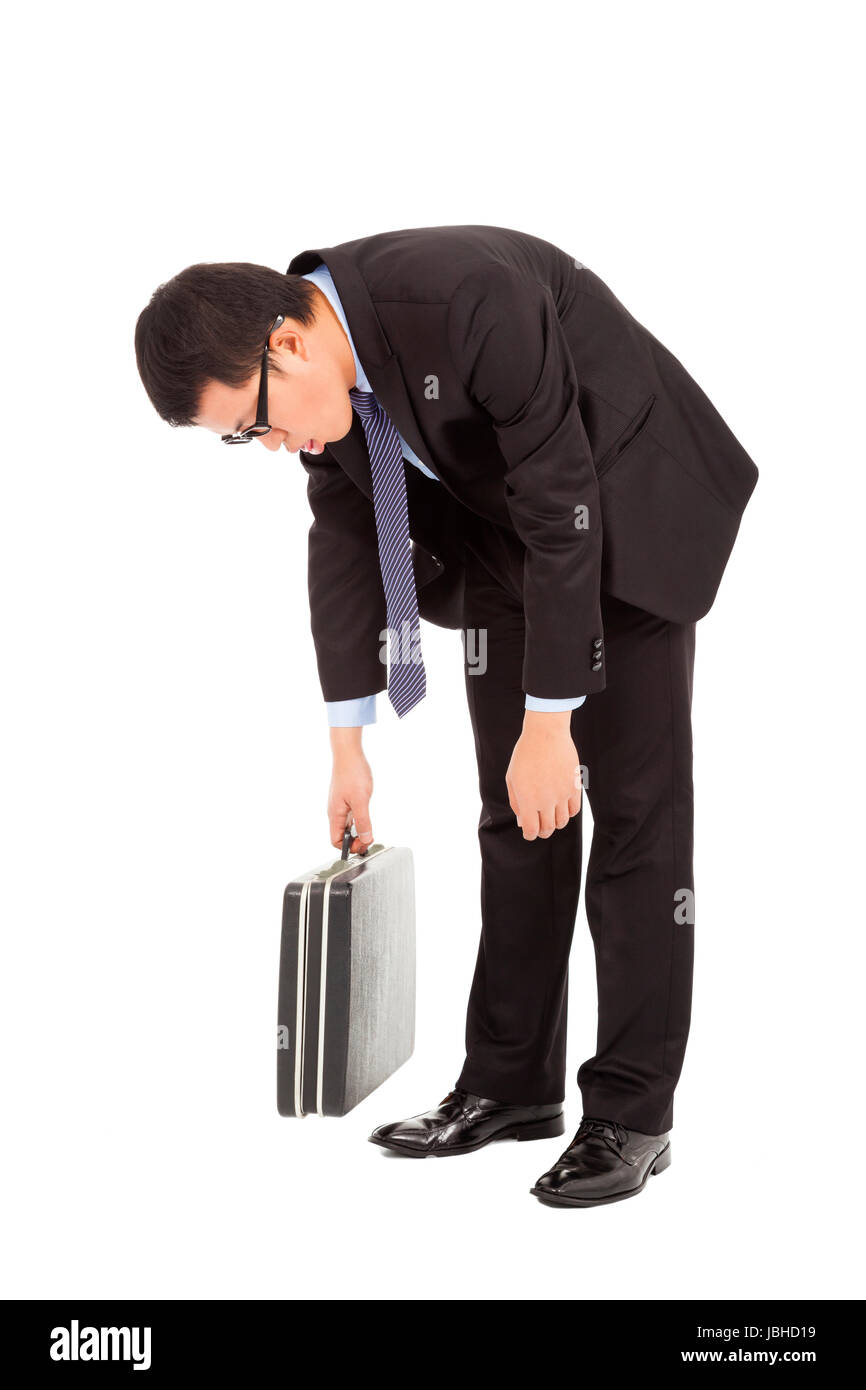 very tired businessman stoop and holding briefcase Stock Photo