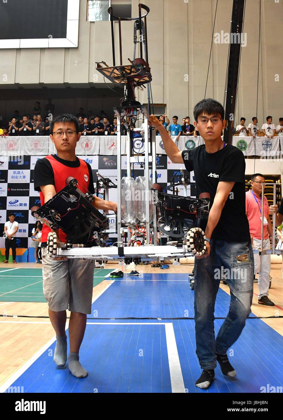 (170611) -- JINAN, June 11, 2017 (Xinhua) -- Contestants of Northeastern University control a robot during the Robocon Finals of the 16th China University Robot Competition in Zoucheng City, east China's Shandong Province, June 11, 2017. Team of Northeastern University took the first prize of the contest.  (Xinhua/Xu Suhui) (wyo) Stock Photo