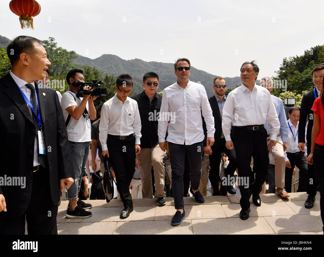 Beijing, China. 11th June, 2017. Luxembourg's Prime Minister Xavier Bettel (C), who is paying an official visit to China, visits the Mutianyu section of the Great Wall in Beijing, capital of China, June 11, 2017. Credit: Jin Liangkuai/Xinhua/Alamy Live News Stock Photo