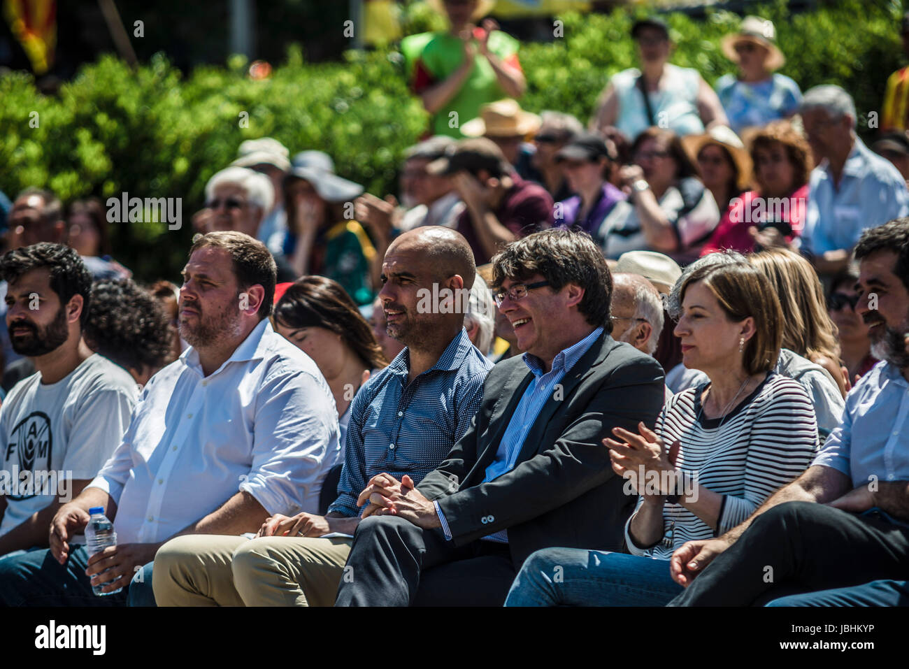 Barcelona, Spain. 11 June, 2017:  ORIOL JUNQUERAS, vice-president of the Catalan government, PEP GUARDIALOA, head coach of Manchester City, CARLES PUIGDEMONT, President of the Catalan government, and CARME FORCADELL, president of the Catalan parliament,  assist a pro-independence concentration at Barcelona's Montjuic Fountains in support of the recently announced referendum over Catalonia's independence from Spain in form of a republic at October 1st Credit: Matthias Oesterle/Alamy Live News Stock Photo