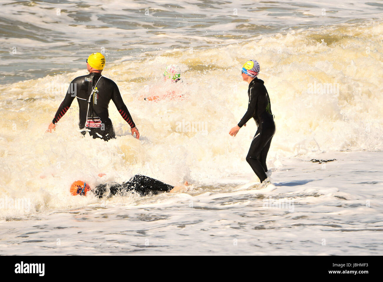 Aberystwyth Wales UK, Sunday 11 June 2017  UK Weather: A group od people in wetsuits having fun in the sea on a blustery summer sunday afternoon in Aberystwyth  on the Cardigan Bay coast of west  Wales  Photo credit: Keith Morris / ALAMY Live News Stock Photo
