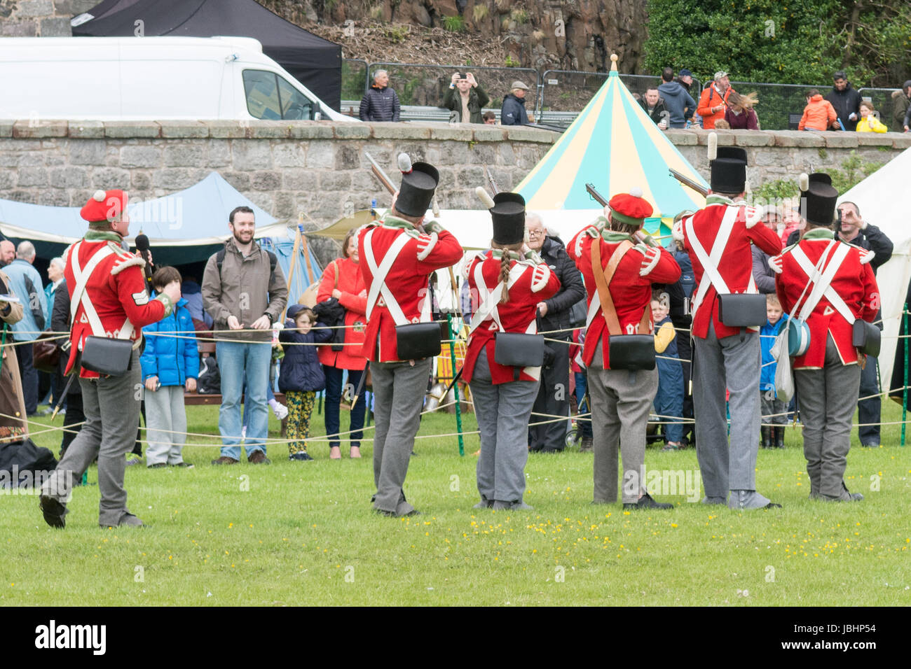 Dumbarton, West Dunbartonshire, Scotland, UK - 11 June 2017: UK weather - a gusty showery day or being in the firing line of Napoleonic soldiers didn't dampen the spirits of visitors to The Rock of Ages - a  two day costume celebration of Scotland's history through the ages at Dumbarton Castle Credit: Kay Roxby/Alamy Live News Stock Photo