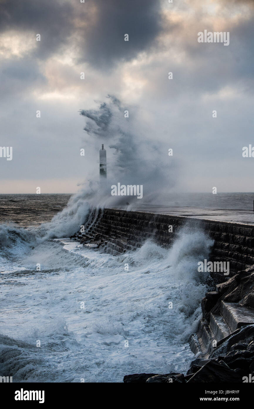 Aberystwyth Wales UK, Sunday 11 June 2017 UK Weather: Unseasonal gale force winds and high tides combine to bring huge waves crashing into the sea defences in Aberystwyth, Wales at the end of the day photo Credit: Keith Morris/Alamy Live News Stock Photo