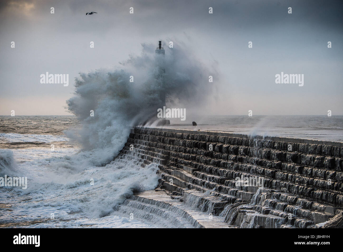 Aberystwyth Wales UK, Sunday 11 June 2017 UK Weather: Unseasonal gale force winds and high tides combine to bring huge waves crashing into the sea defences in Aberystwyth, Wales at the end of the day photo Credit: Keith Morris/Alamy Live News Stock Photo
