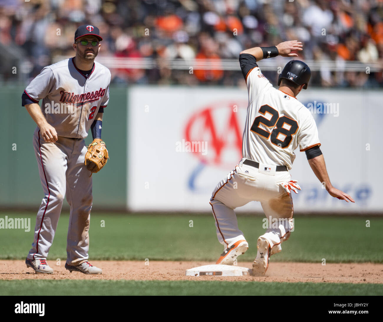 San Francisco, California, USA. 11th June, 2017. San Francisco Giants catcher Buster Posey (28) comes into second base on a sacrifice hit, during a MLB baseball game between the Minnesota Twins and the San Francisco Giants on ''Dog Days of Summer'' at AT&T Park in San Francisco, California. Valerie Shoaps/CSM/Alamy Live News Stock Photo