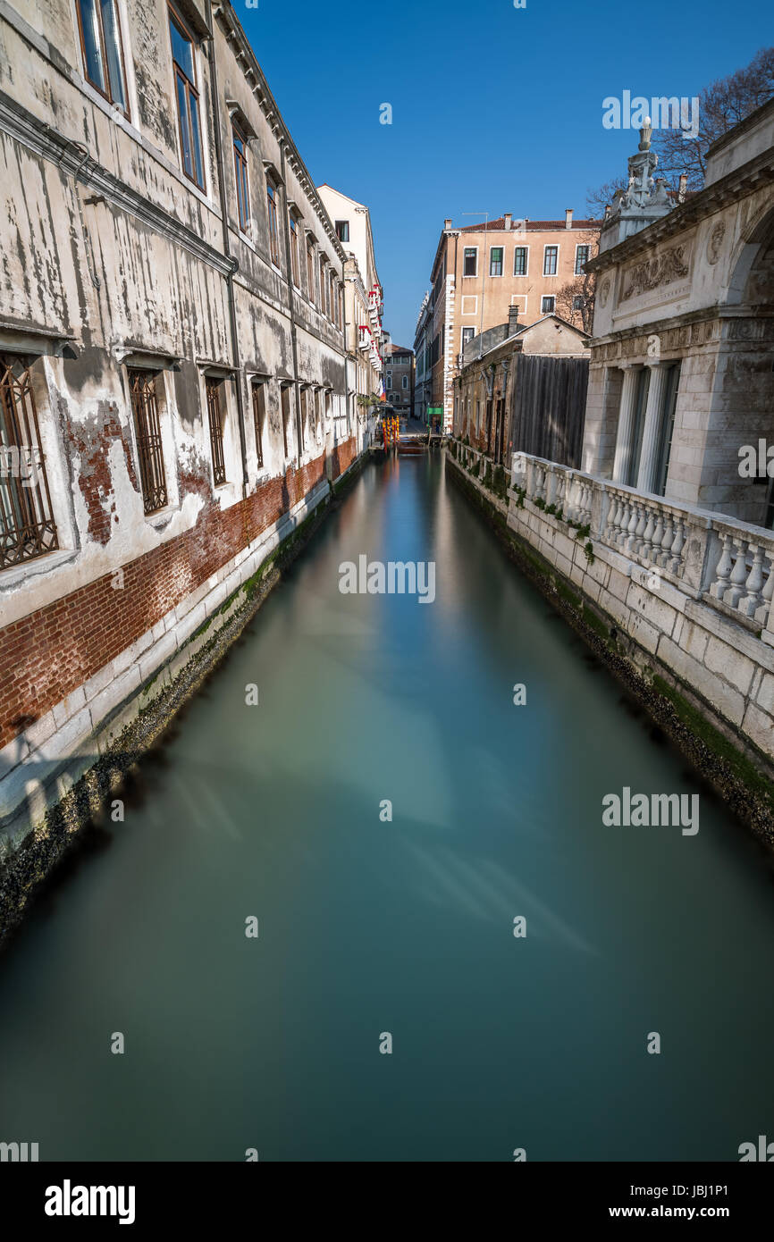 Narrow Canal Among Old Colorful Brick Houses in Venice, Italy Stock ...