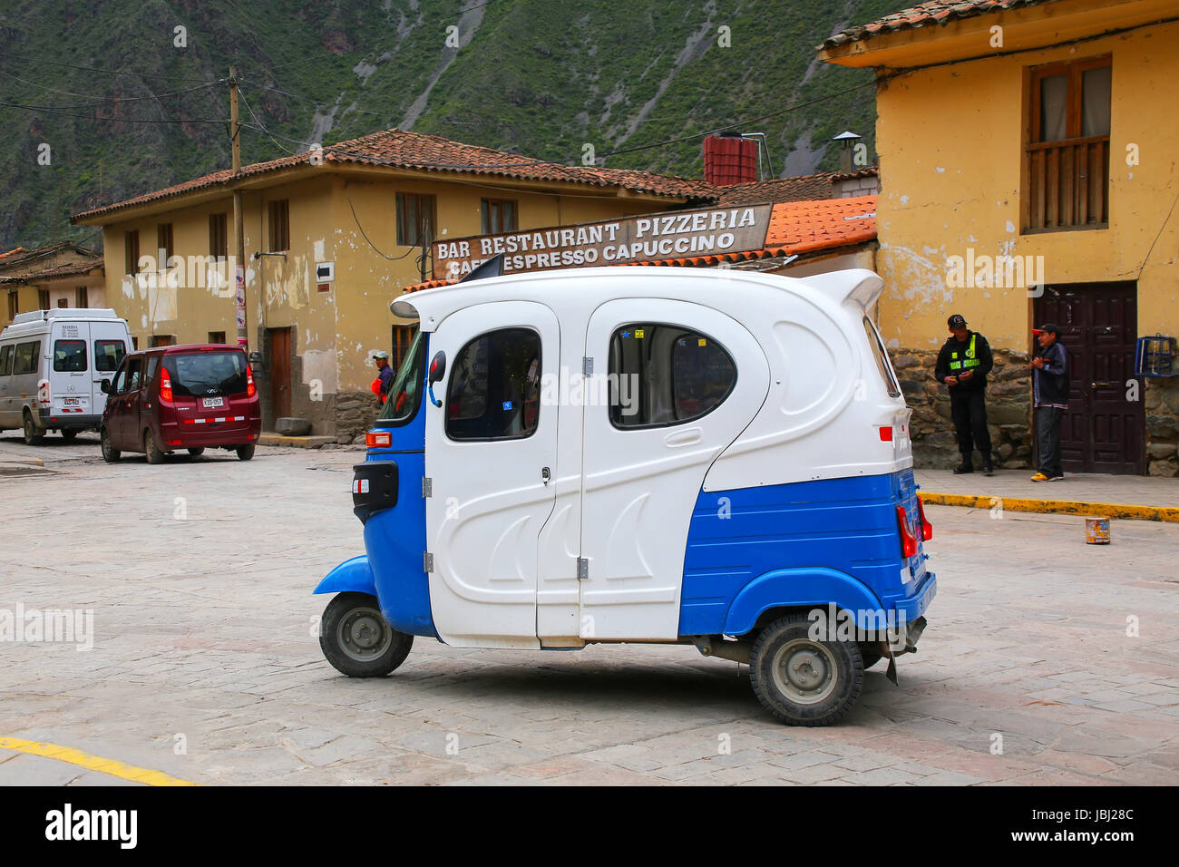 Auto rickshaw in the street of Ollantaytambo, Peru. Ollantaytambo was the royal estate of Emperor Pachacuti who conquered the region. Stock Photo