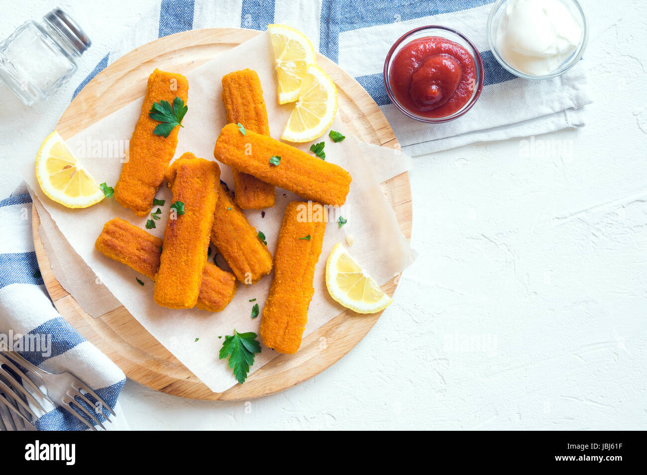 Fried Fish Sticks. Fish Fingers. Fish Sticks with lemon and sauces