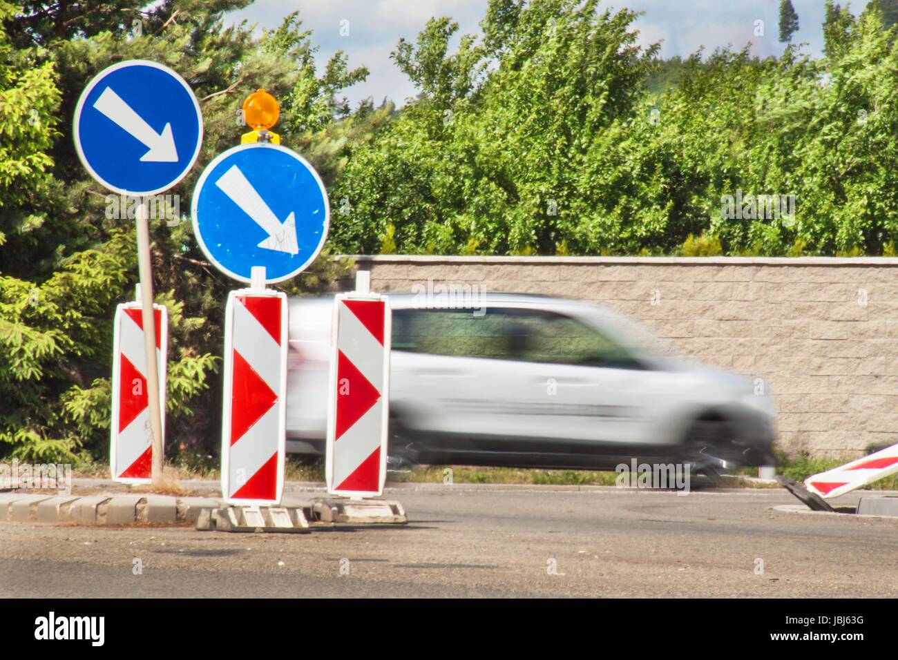 Detour on the road. Traffic signs. Repair of asphalt road Stock Photo