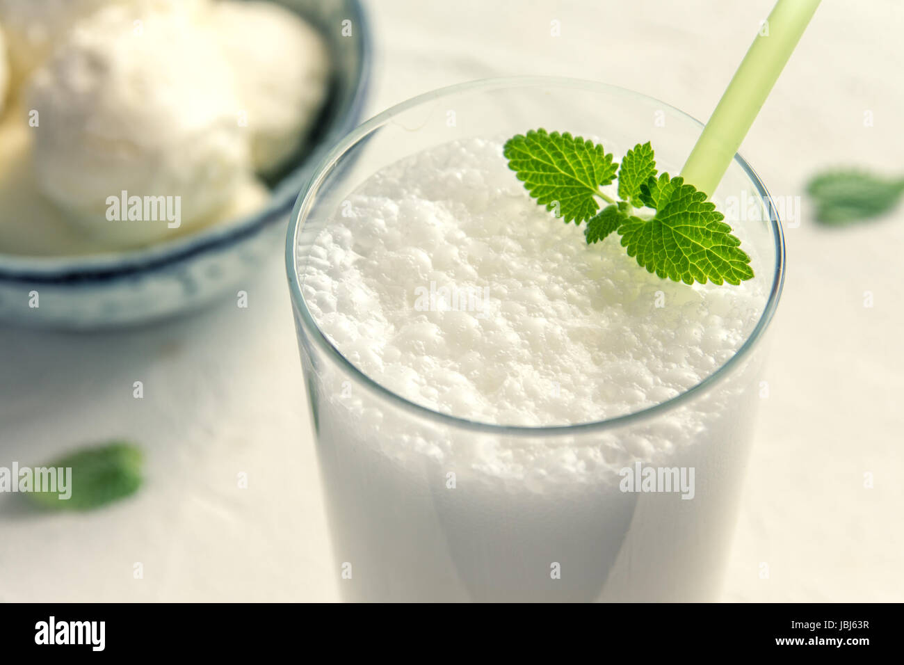 Vanilla Shake with Ice Cream and Mint on white background. Vanilla Ice