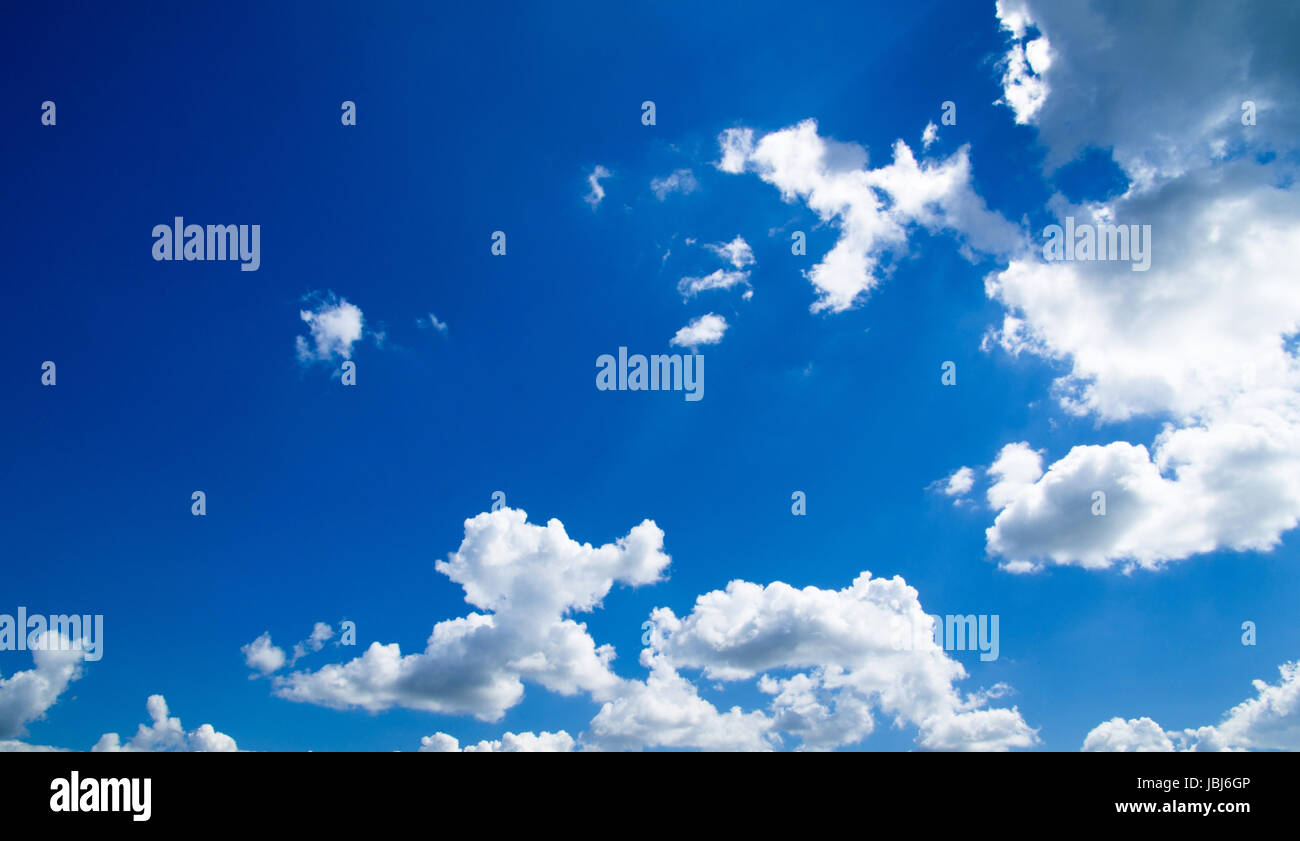 Blue sky background with a tiny clouds Stock Photo - Alamy