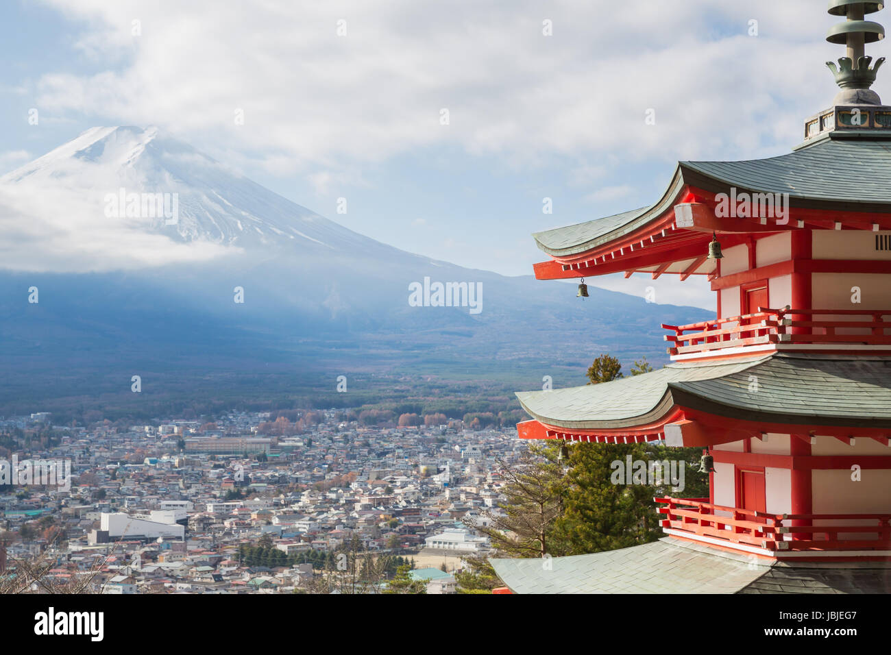 Red Shureito pagoda with Mountain Fuji landscape and Yamanashi city as the background Stock Photo
