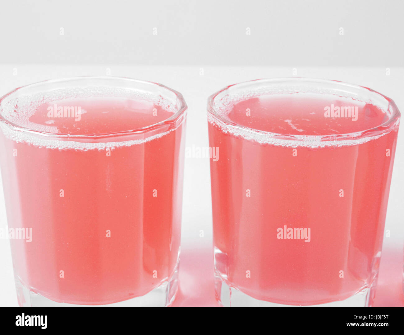 Pink grapefruit juice glasses on continental breakfast table Stock Photo Alamy