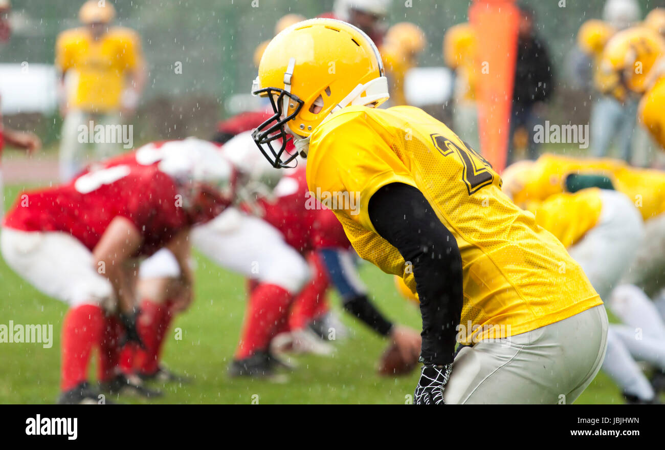 American football game in rain Stock Photo Alamy