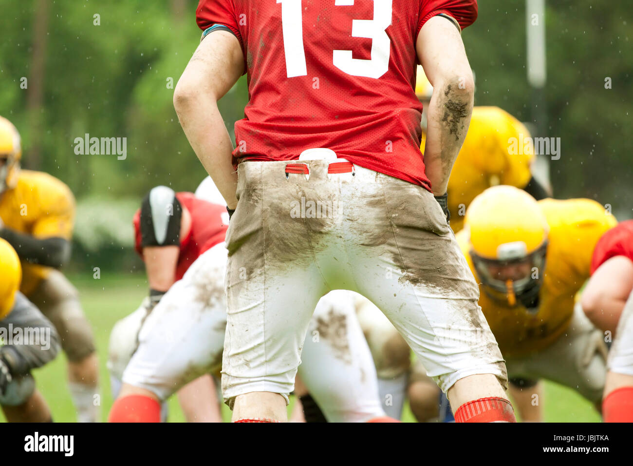 American football game in rain Stock Photo Alamy