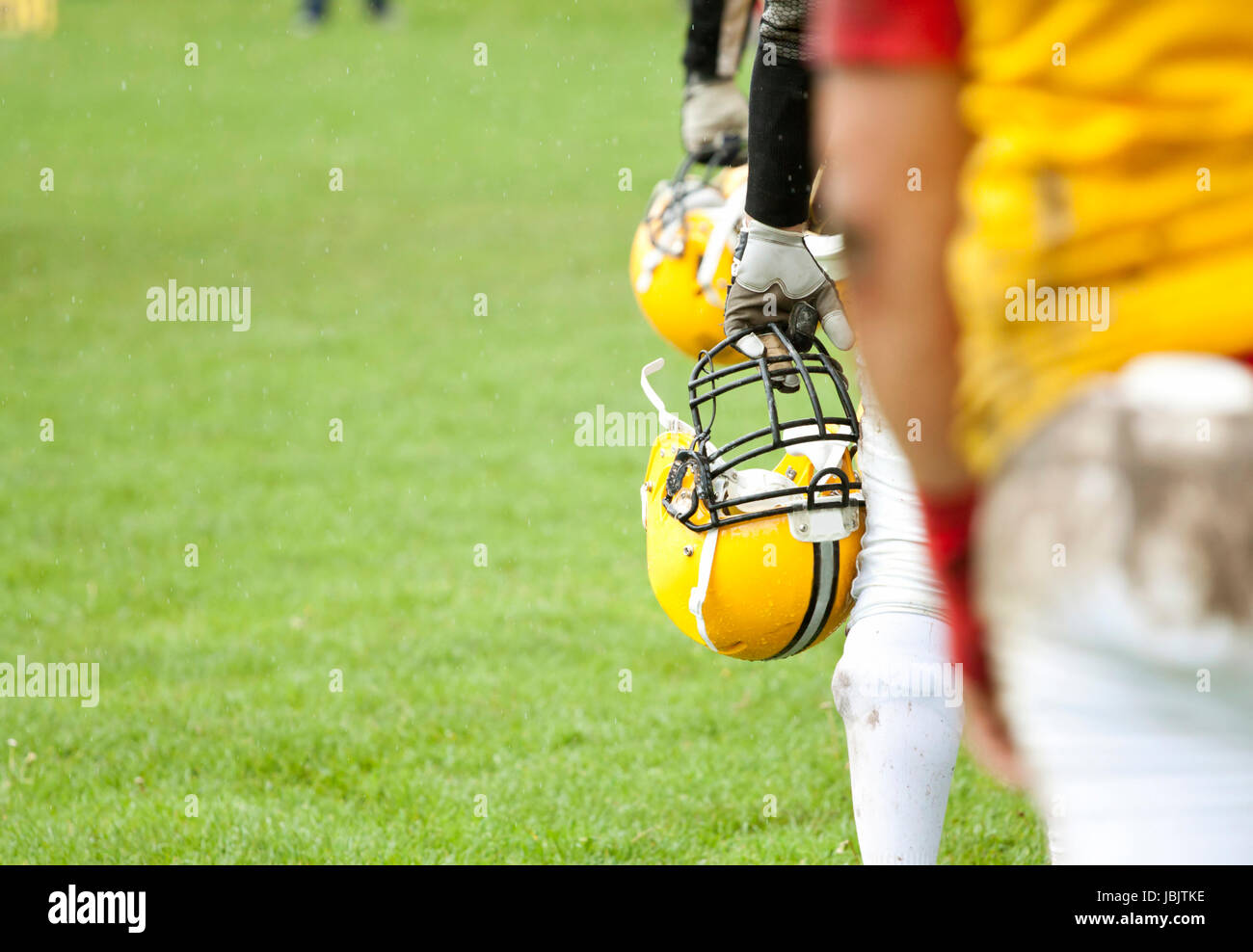 American football game in rain Stock Photo Alamy