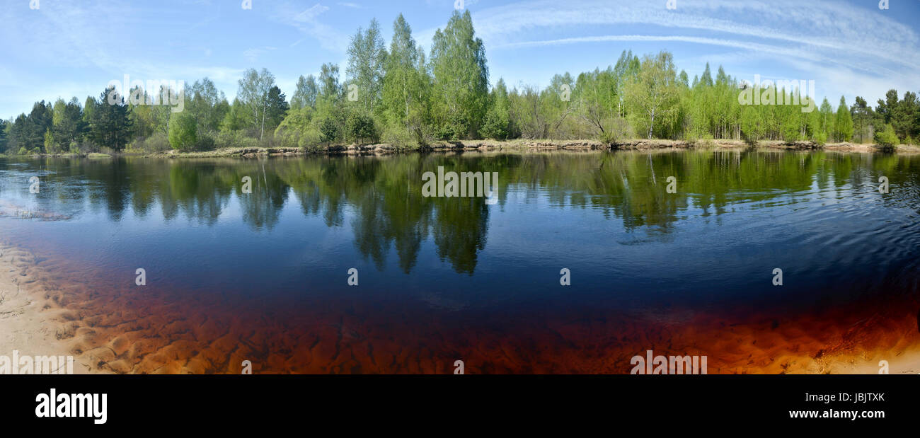 Panorama of the spring river. May water landscape in the national park ...