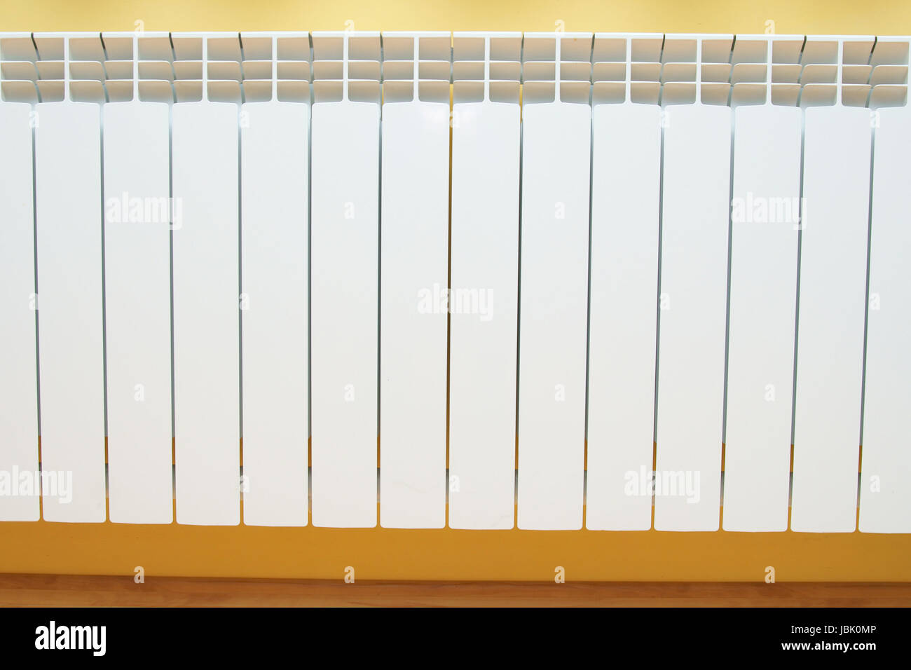 white radiator and yellow background Stock Photo Alamy