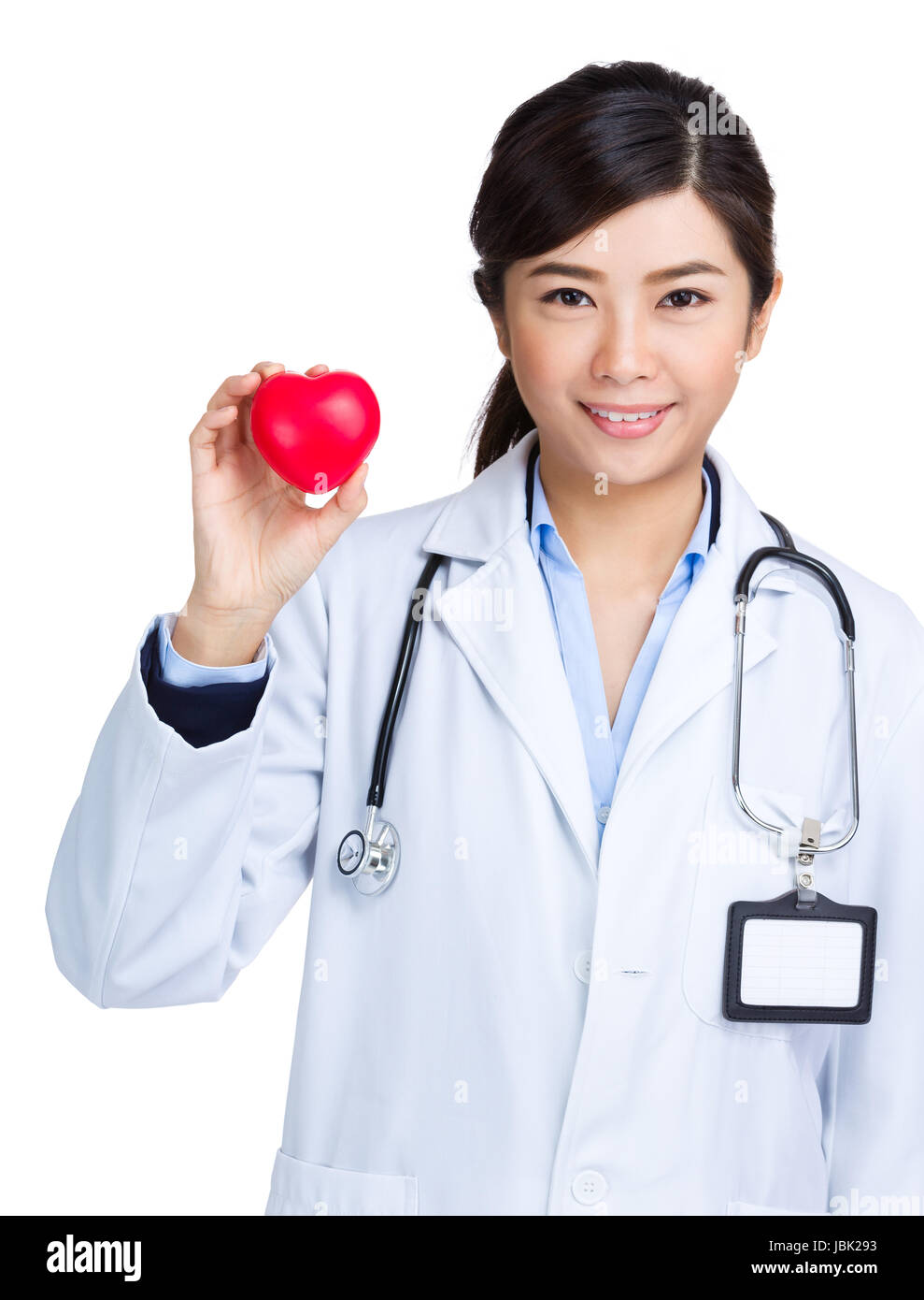 Female doctor holding heart shape ball Stock Photo - Alamy