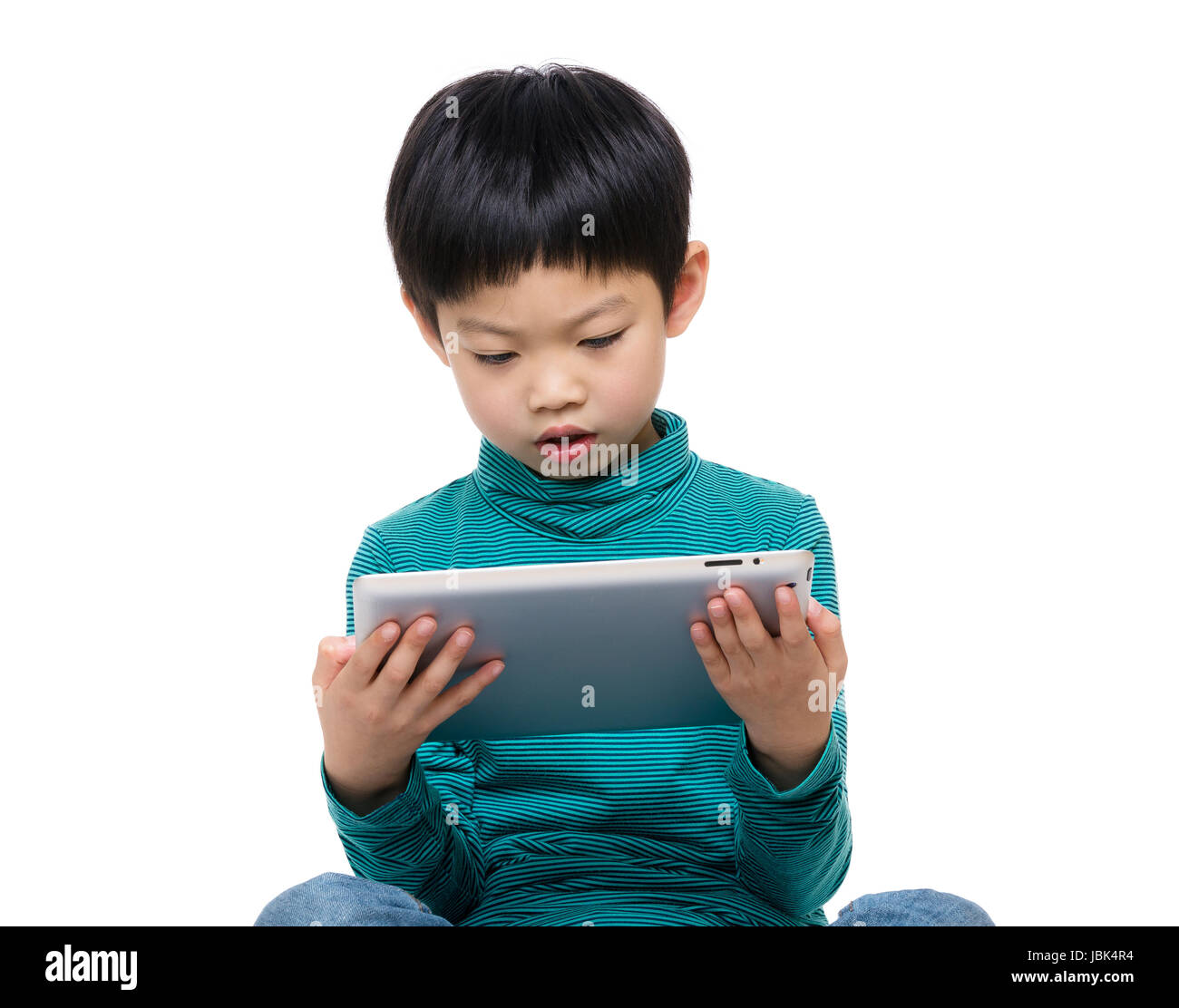 Little boy using tablet computer Stock Photo - Alamy