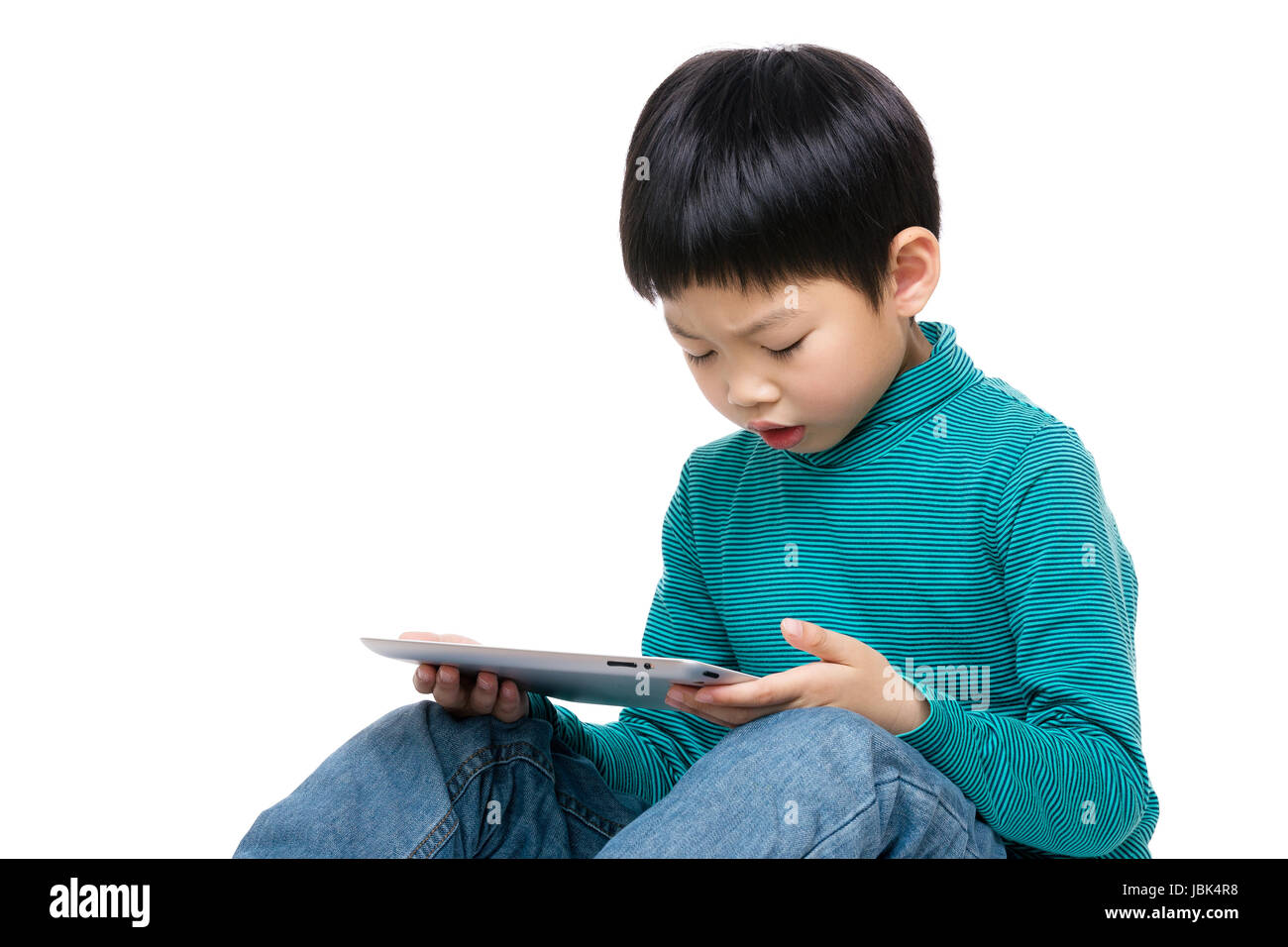 Little boy using tablet Stock Photo - Alamy