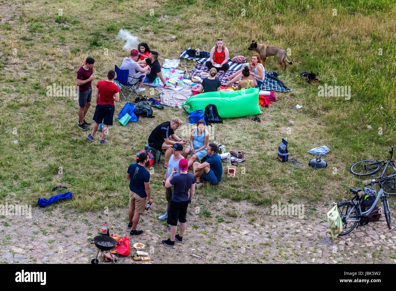 People make a picnic on the riverbank of the Elbe river, Dresden Germany Stock Photo