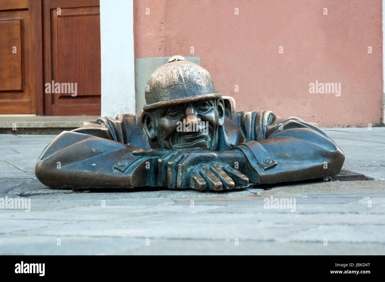 Cumil, emerging statue in the city of Bratislava, Slovakia. Stock Photo