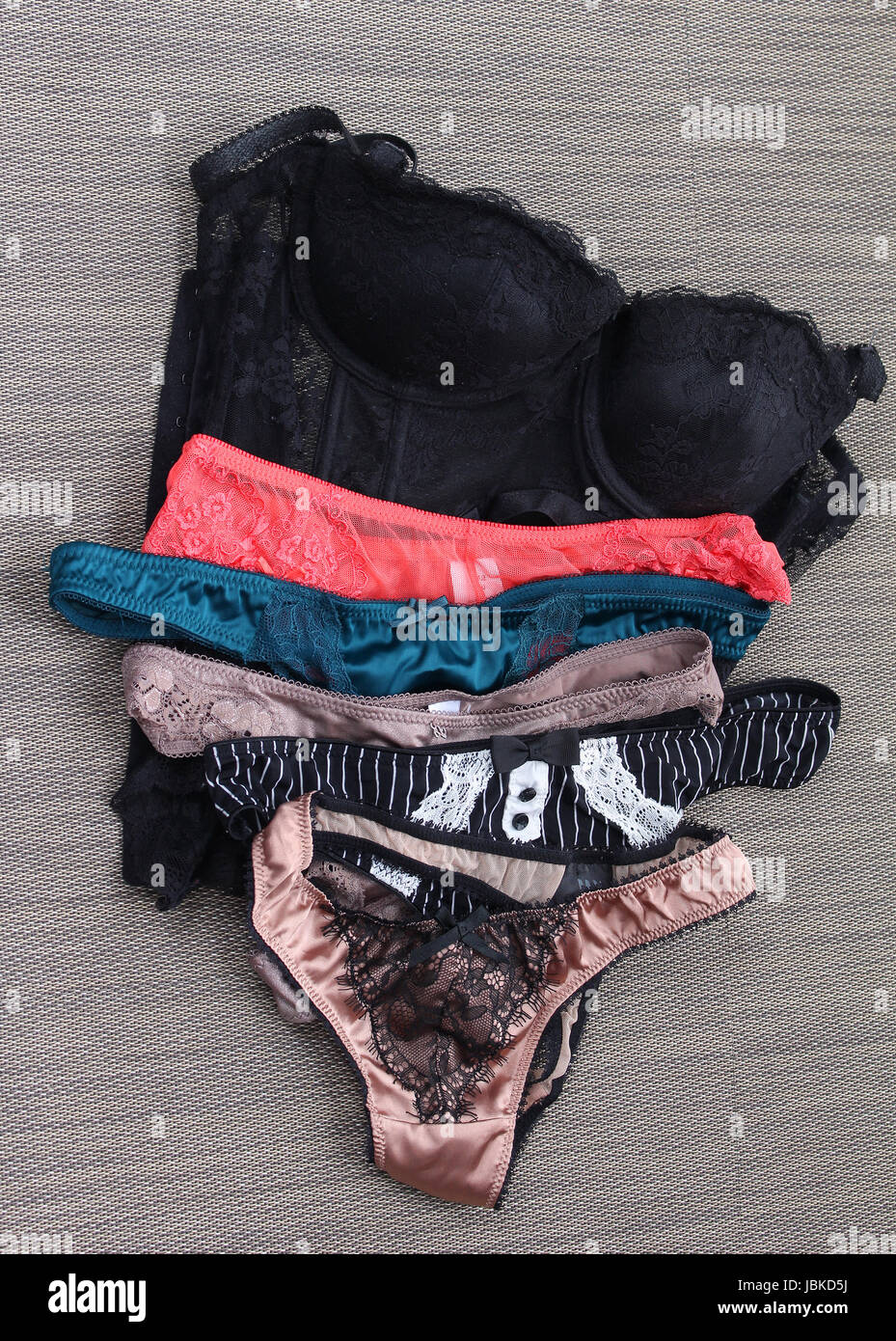 Sexy female lingerie silk lace panties pile Stock Photo