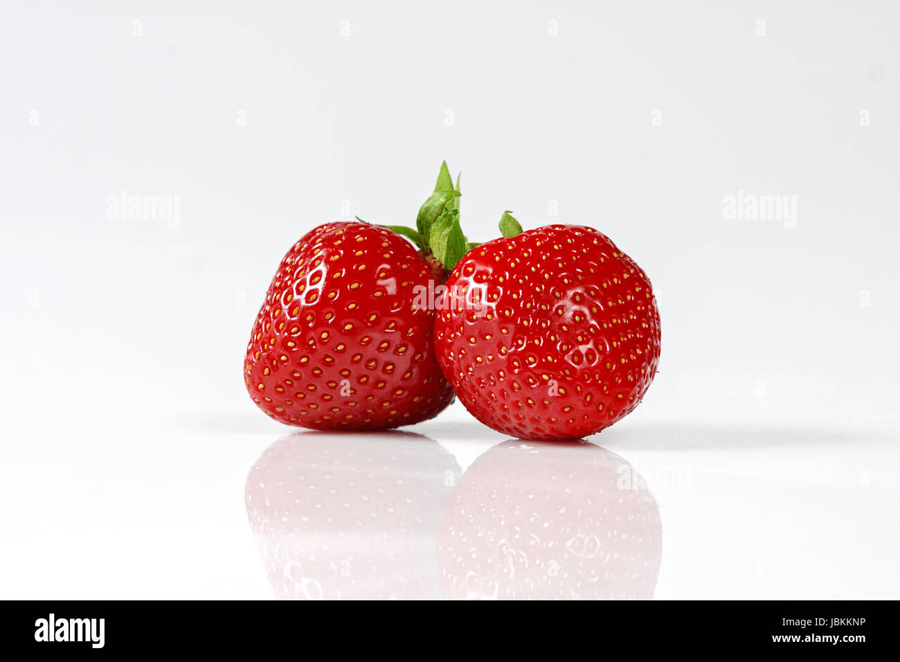 Two red strawberrys isolated on white background. Stock Photo