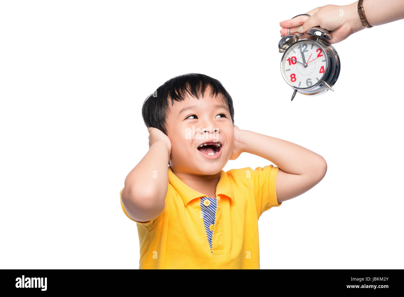 Shocked pupil with big alarm clock giving from his mom Stock Photo Alamy